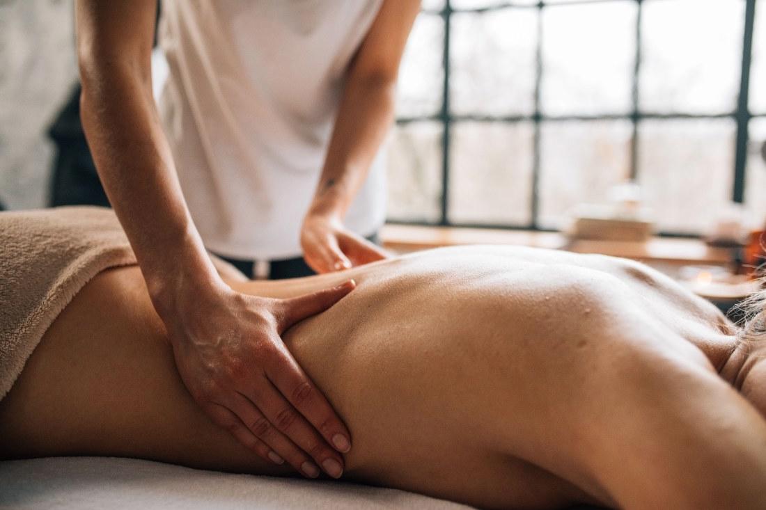 Relaxing body massage in a bright Los Angeles spa room